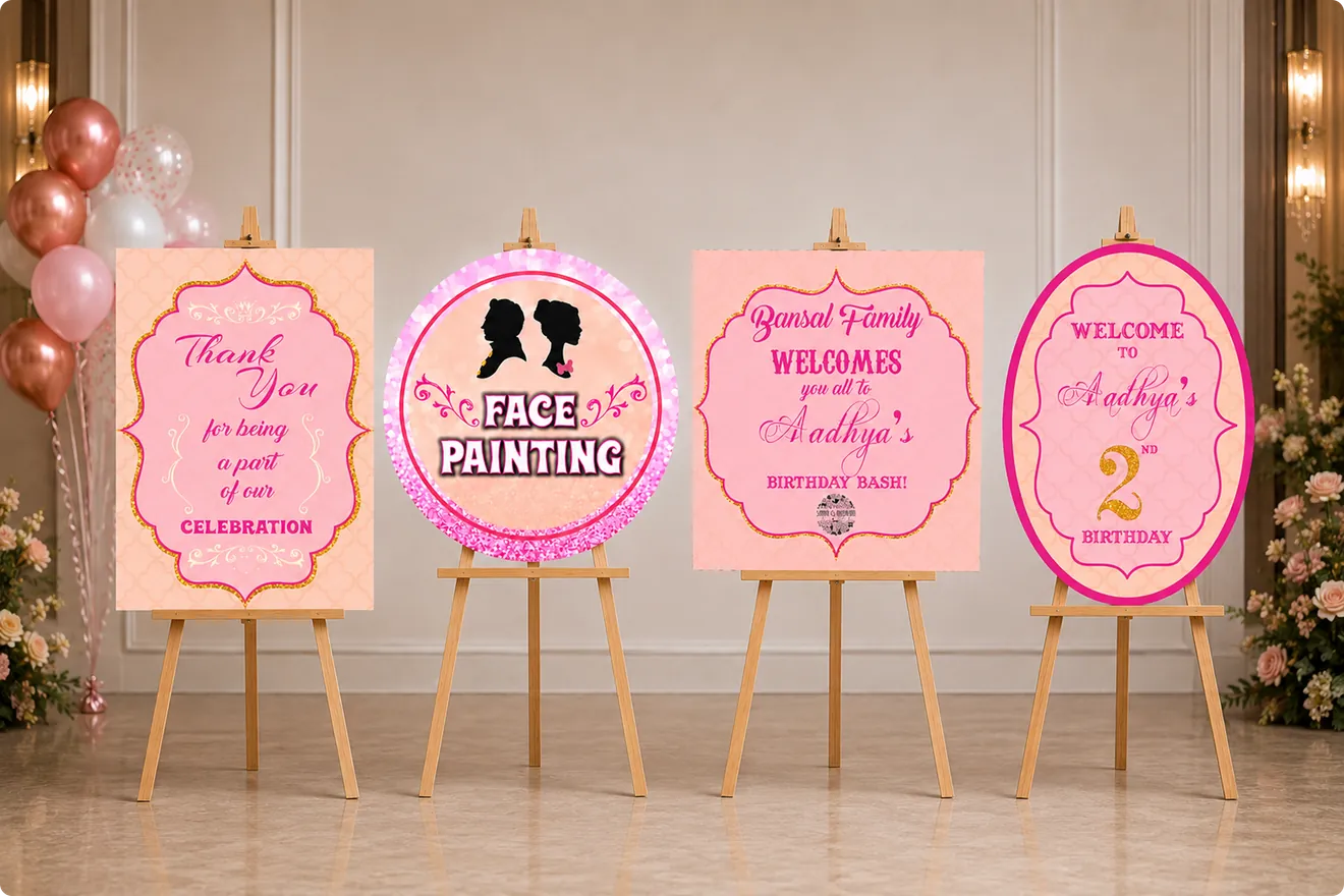 Four Aadhya birthday signs on easels: thank you, face painting, family welcome and welcome