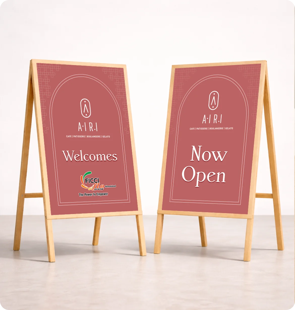 Two pink Airi welcome boards with branding