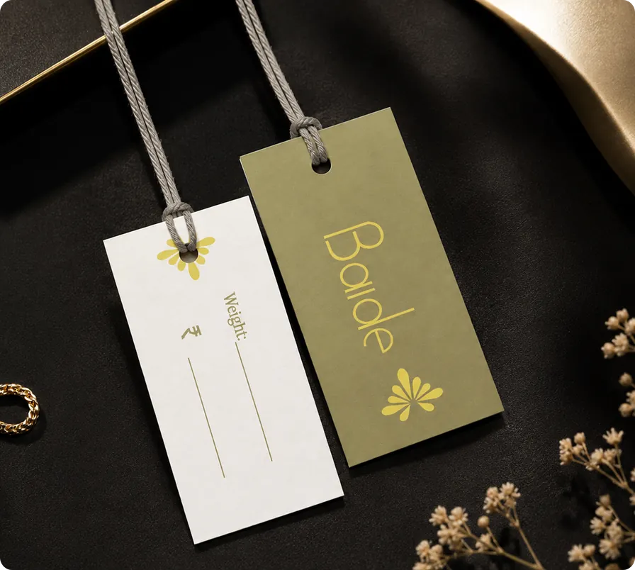 Baide branded hang tags in gold and cream with butterfly motif