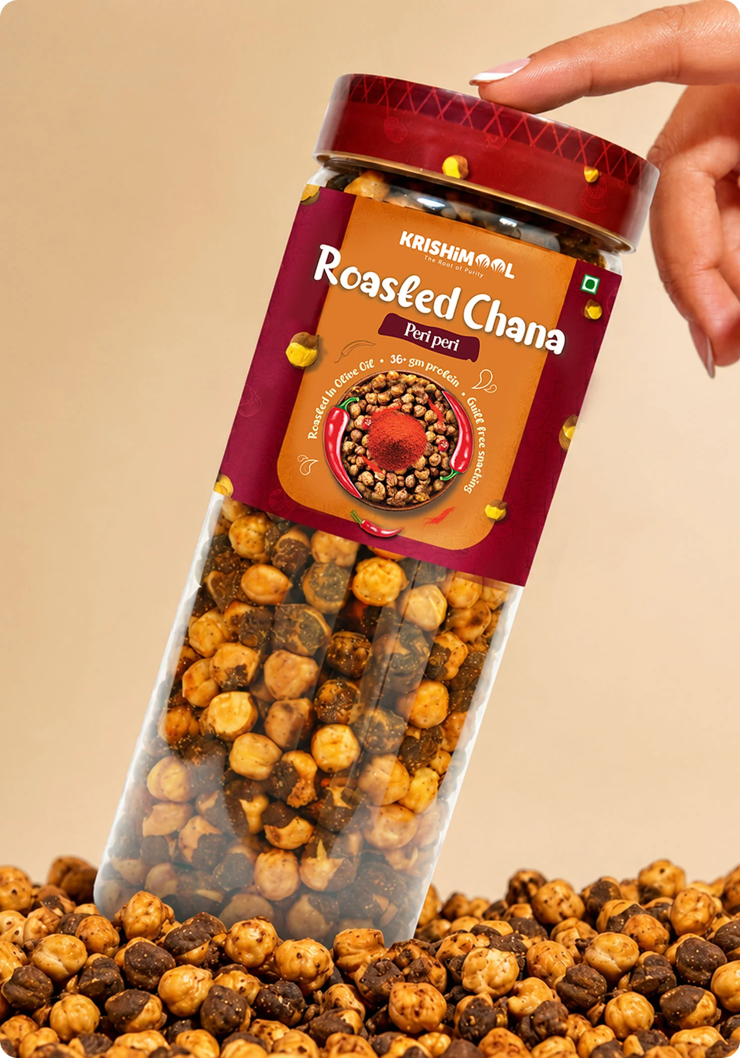 KrishiMool Roasted Chana Peri Peri flavour jar held by hand